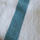 Elina white washed linen tea towel with turquoise stripe